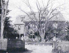 The Dorchester School for Girls ca. 1898. This is a black and white photograph of the front of the school